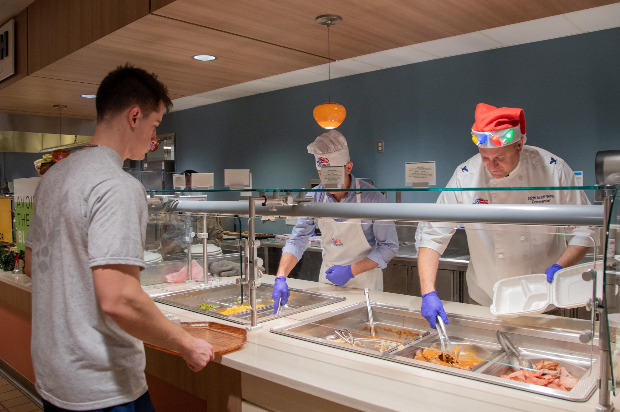 512th Airlift Wing leadership serves a holiday meal