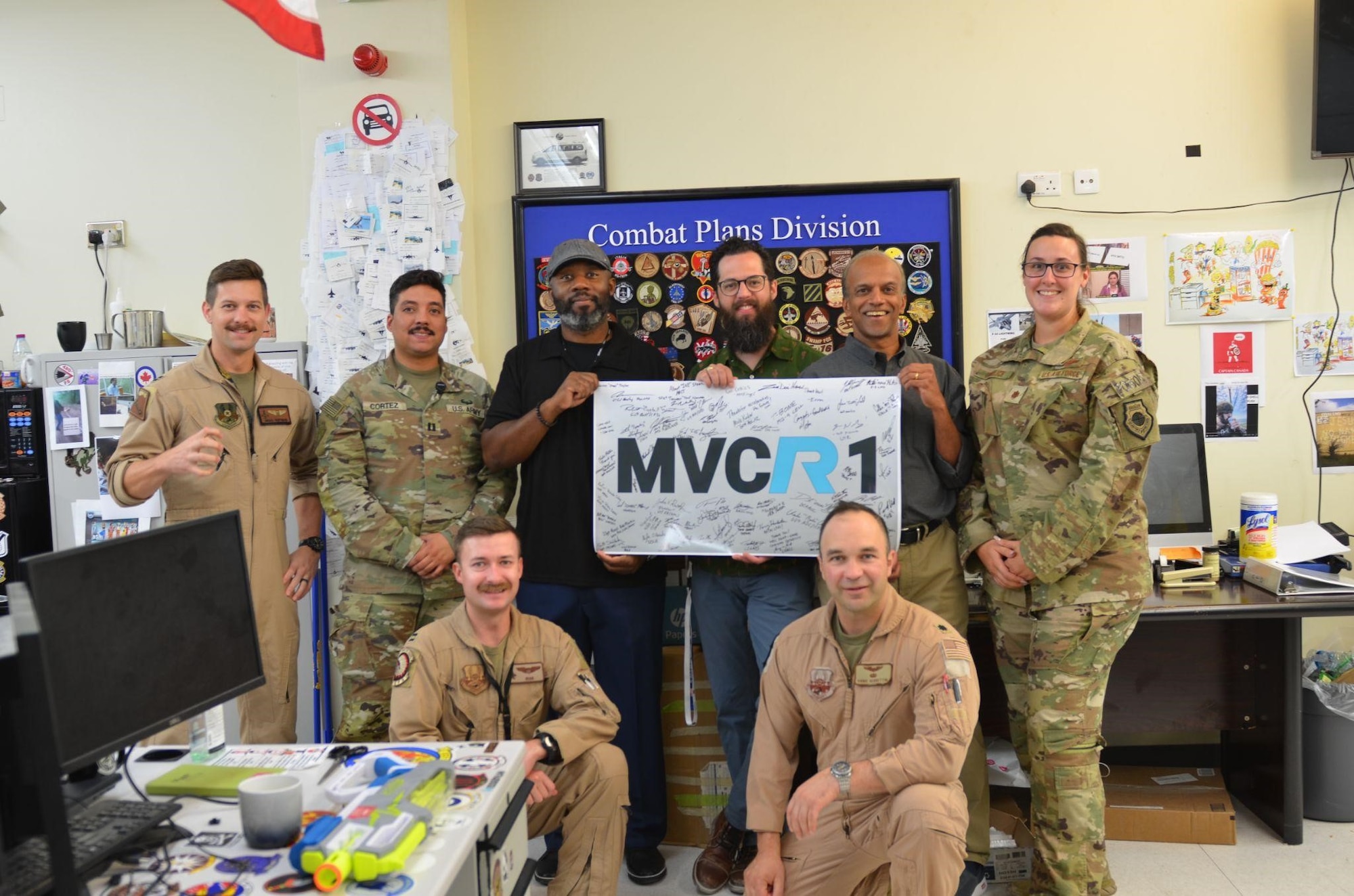 U.S. Air Force members and Kessel Run personnel celebrate the successful adoption of Kessel Run’s Minimum Viable Capability Release 1, at the 609th Air Operations Center Headquarters, Al Udeid Air Base, Qatar, Sept. 21, 2022. Kessel Run is a Division within Air Force Life Cycle Management Center’s Digital Directorate.