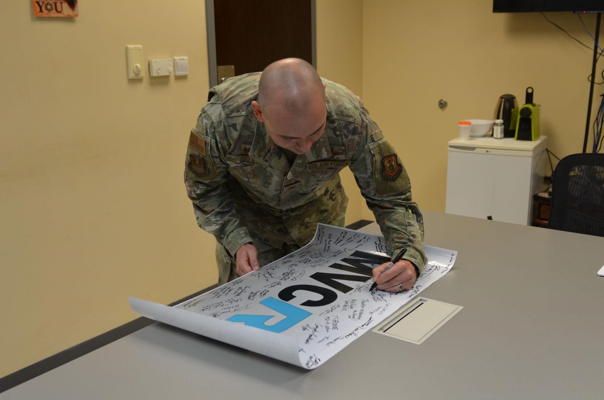 U.S. Air Force members and Kessel Run personnel celebrate the successful adoption of Kessel Run’s Minimum Viable Capability Release 1, at the 609th Air Operations Center Headquarters, Al Udeid Air Base, Qatar, Sept. 21, 2022. Kessel Run is a Division within Air Force Life Cycle Management Center’s Digital Directorate.