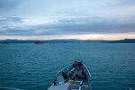 KOPER, Slovenia (Dec. 3, 2022) The Ticonderoga-class guided-missile cruiser USS Leyte Gulf (CG 55) arrives in Koper, Slovenia, for a scheduled port visit. The George H.W. Bush Carrier Strike Group is on a scheduled deployment in the U.S. Naval Forces Europe area of operations, employed by U.S. Sixth Fleet to defend U.S., allied, and partner interests. (U.S. Navy photo by Mass Communication Specialist 2nd Class Christine Montgomery)