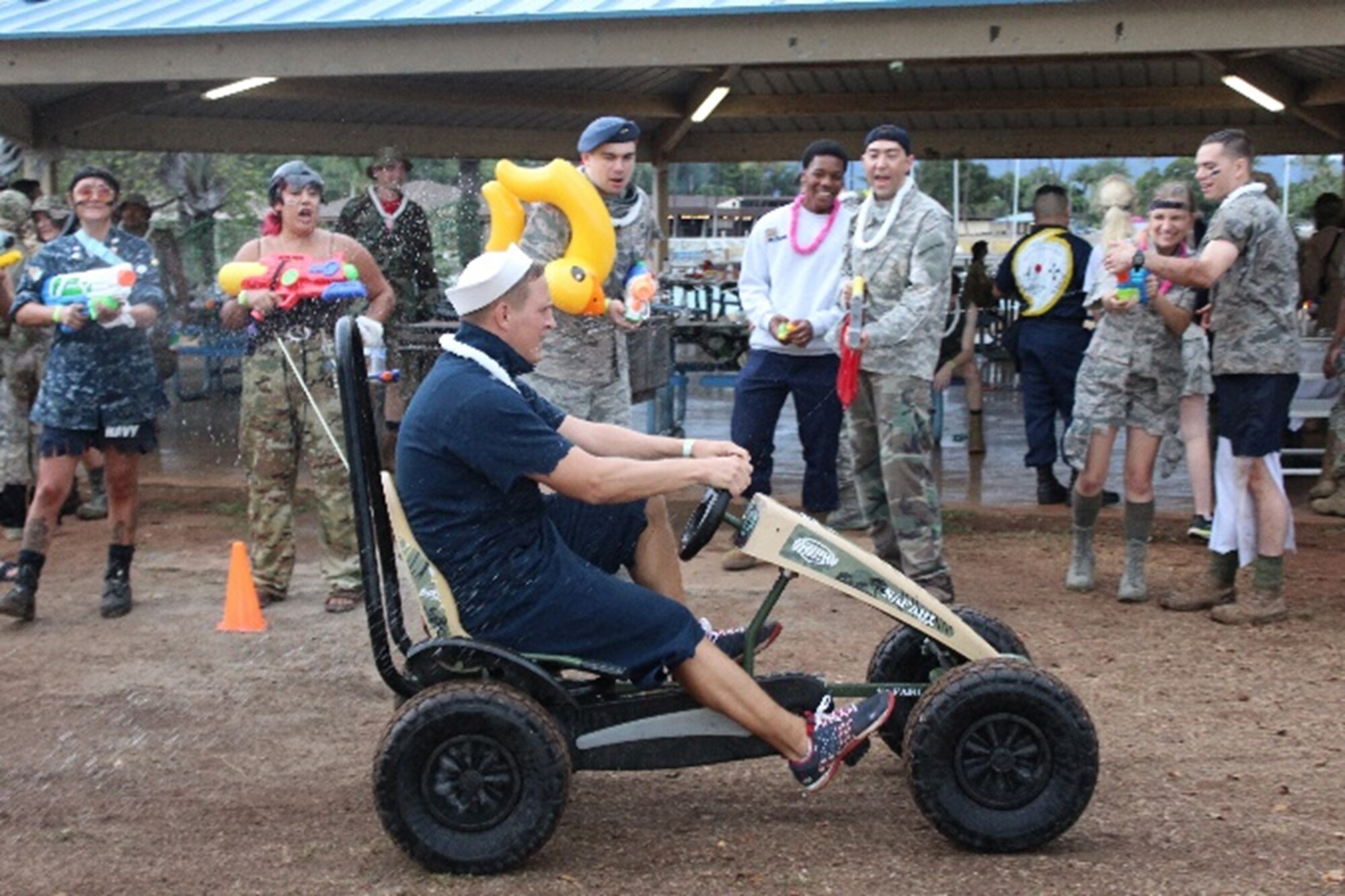A member of the Joint Typhoon Warning Center riding a go-kart on the obstacle course during a Combat Dining-In on Sept. 16 at Hickam Air Force Base, Hawaii.