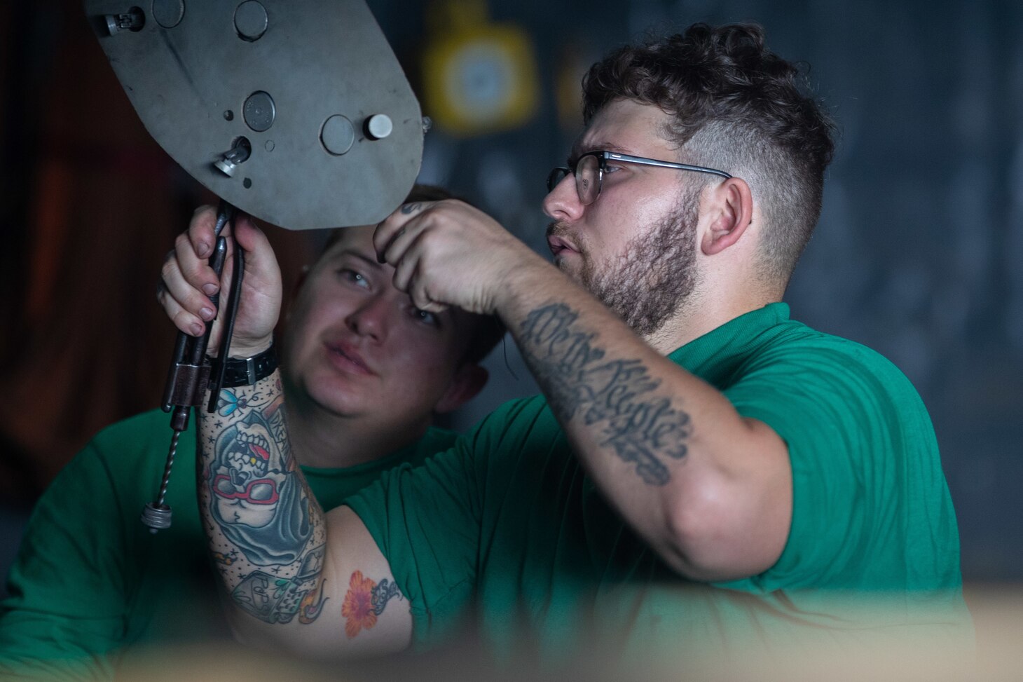 Aviation Structural Mechanic Airman Jordan Dicker, right, from Sebastian, Florida, and Aviation Structural Mechanic 3rd Class Brandon Coffman, from Morrow, Ohio, both assigned to the "Blacklions" of Strike Fighter Squadron (VFA) 213, perform routine maintenance on a F/A-18F Super Hornet in the first-in-class aircraft carrier USS Gerald R. Ford's (CVN 78) hangar bay, Oct. 8, 2022.