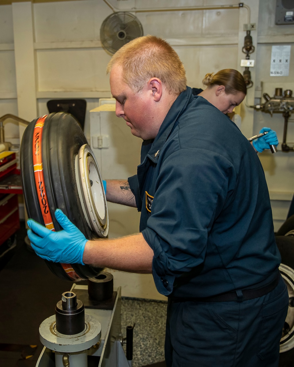 Aviation Structural Mechanic 3rd Class Daniel Mitchell, from Colorado Springs, Colorado, assigned to the first-in-class aircraft carrier USS Gerald R. Ford’s (CVN 78) aircraft intermediate maintenance department, performs routine maintenance, Oct. 8, 2022.