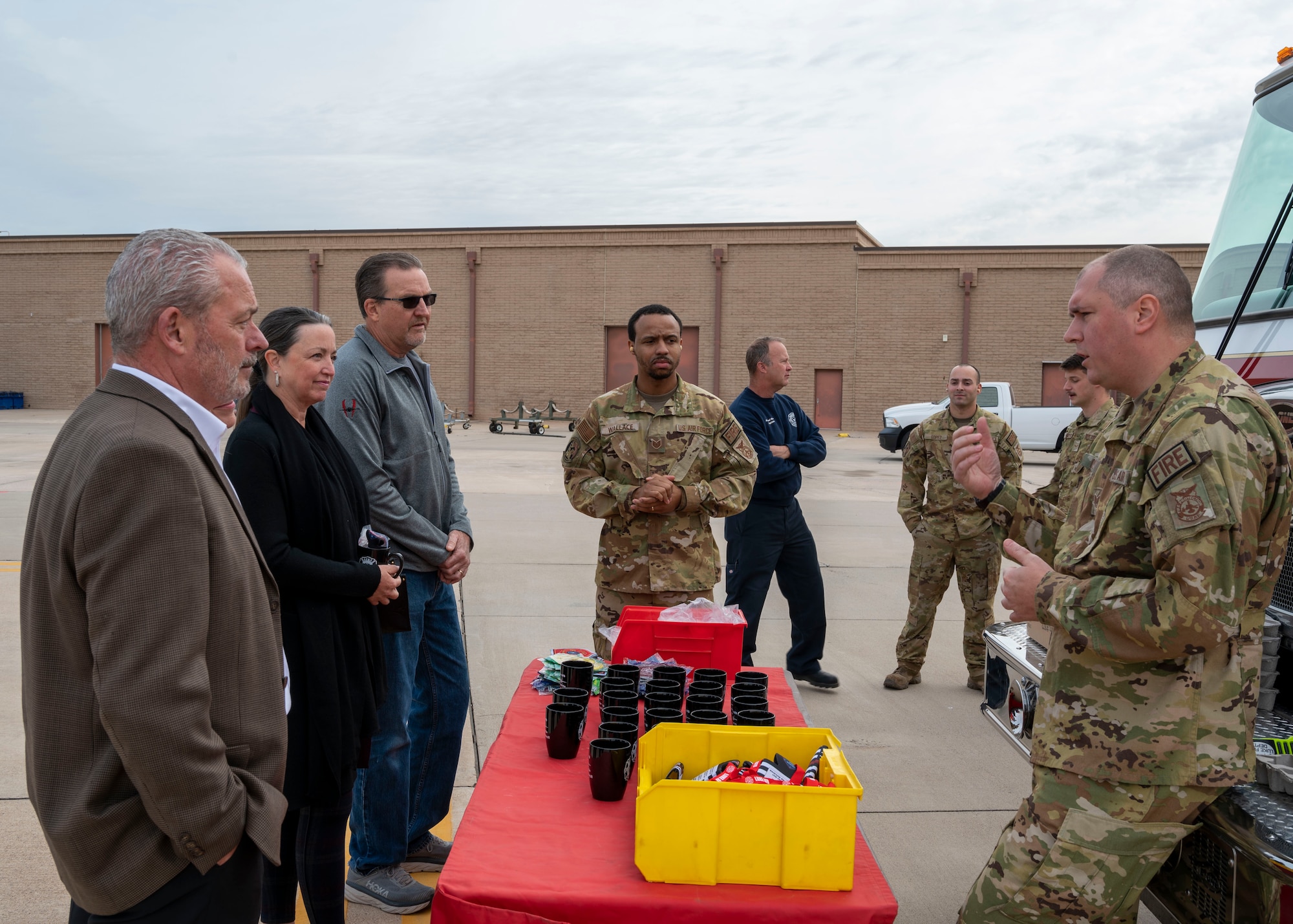 U.S. Air Force Tech. Sgt. Ian Coye, 56th Civil Engineer Squadron firefighter, describes the fire department’s role to guests during the 56th Operations and Maintenance Group Open House, Dec. 2, 2022, at Luke Air Force Base, Arizona.