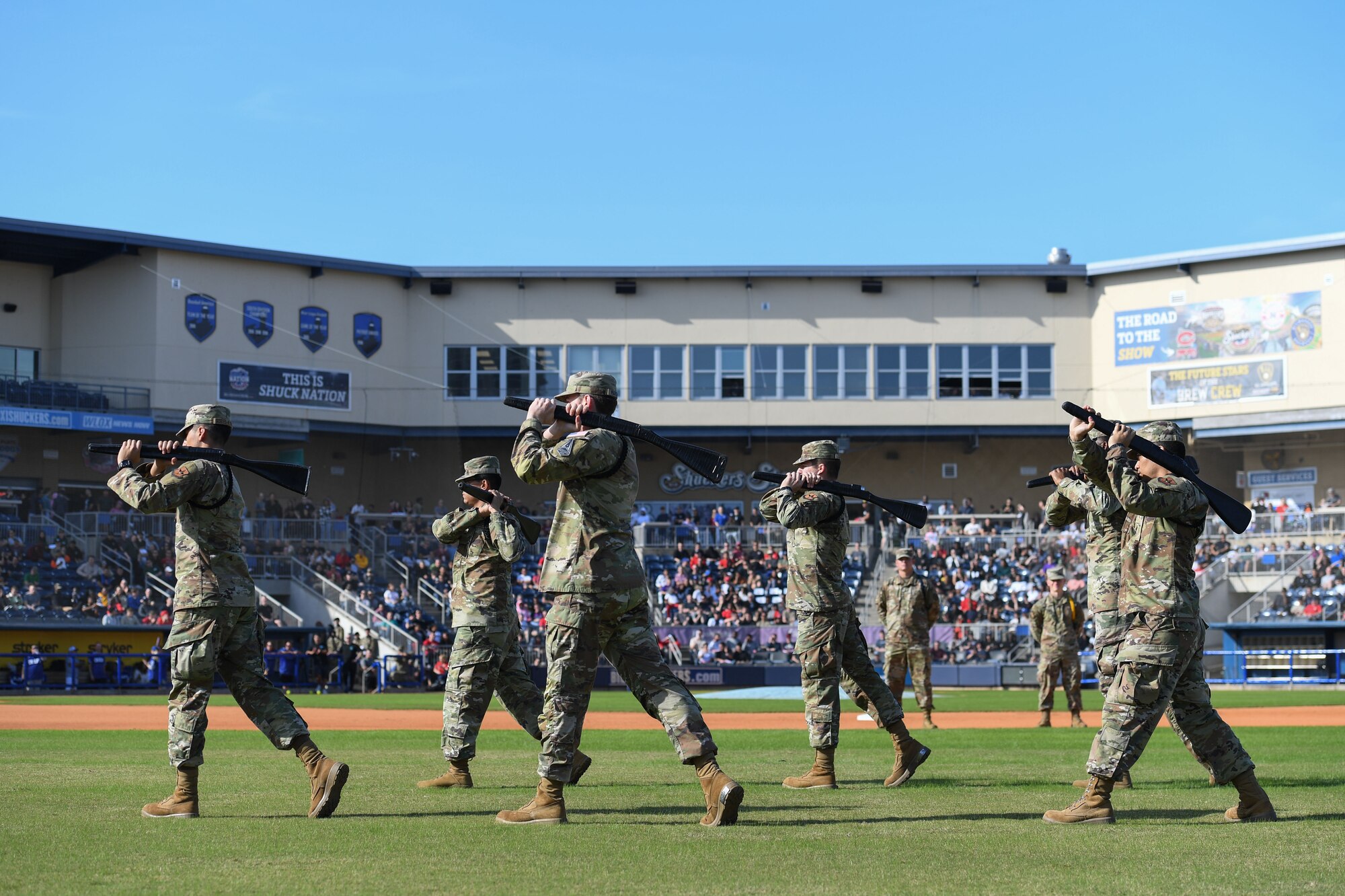 Members of the 338th Training Squadron participate in a freestyle drill competition at MGM Park in Biloxi, Mississippi, Dec. 5, 2022.