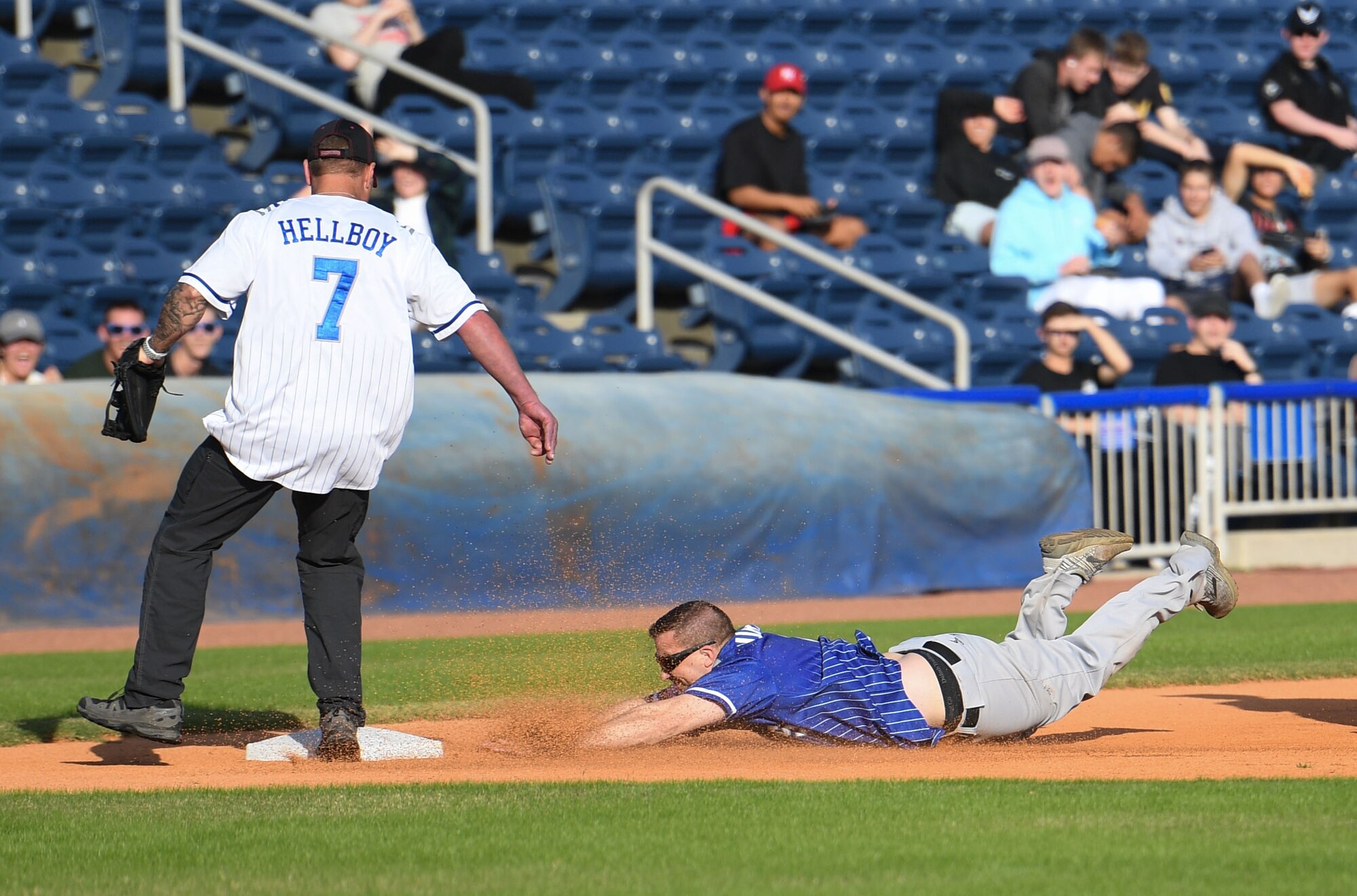 U.S. Air Force Lt. Col. Christopher Dauer, 81st Mission Support Group deputy commander, and Chief Master Sgt. Donald Burkhart, Second Air Force training pipeline manager, participate in the 2nd Annual Chiefs vs. Eagles softball game at MGM Park in Biloxi, Mississippi, Dec. 5, 2022.