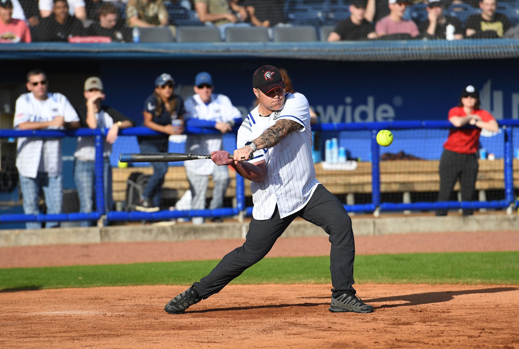 U.S. Air Force Lt. Col. Christopher Dauer, 81st Mission Support Group deputy commander, swings at a softball during the 2nd Annual Chiefs vs. Eagles softball game at MGM Park in Biloxi, Mississippi, Dec. 5, 2022.