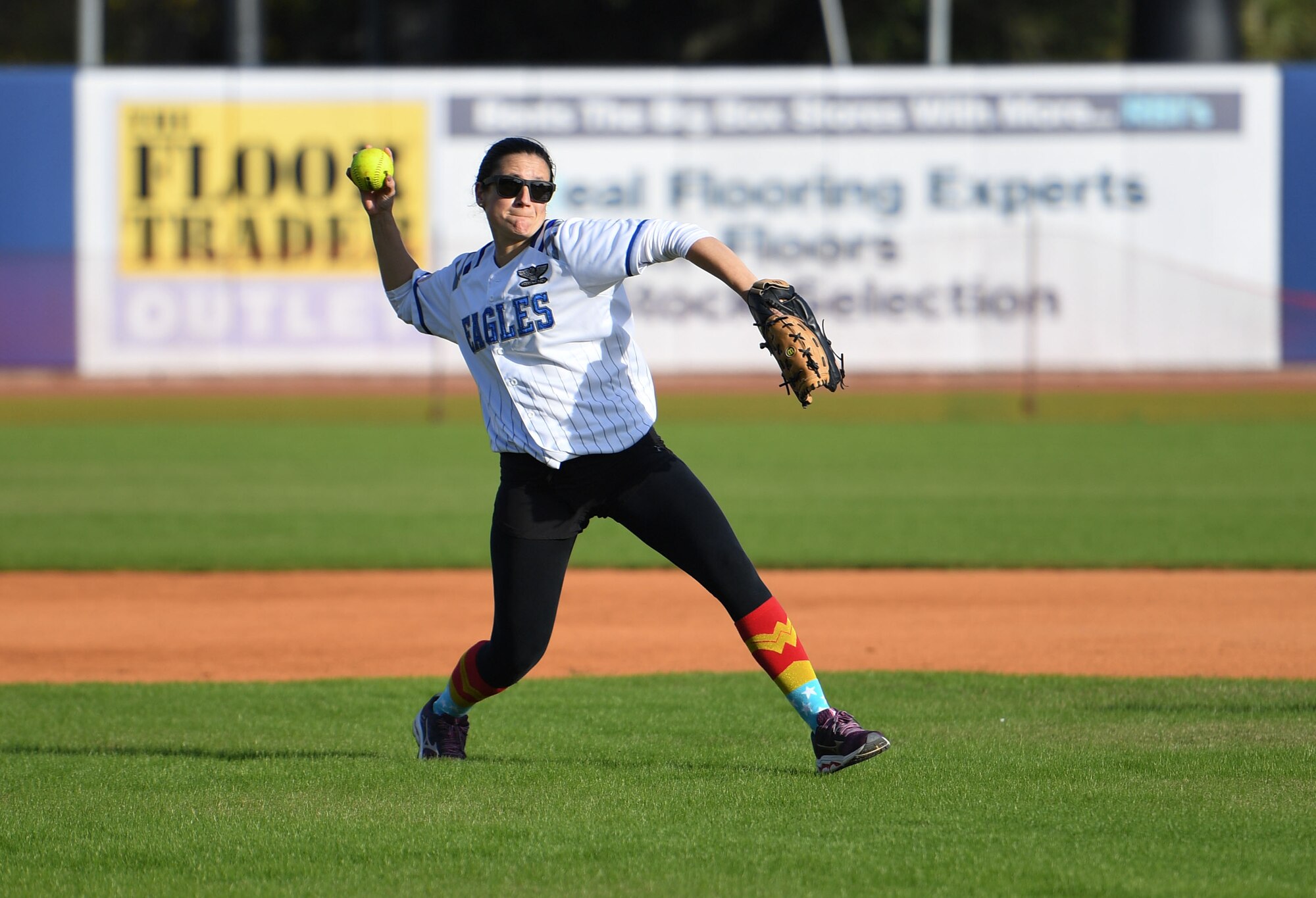U.S. Air Force Lt. Col. Katherine Kuc, 81st Force Support Squadron commander, launches a softball during the 2nd Annual Chiefs vs. Eagles softball game at MGM Park in Biloxi, Mississippi, Dec. 5, 2022.