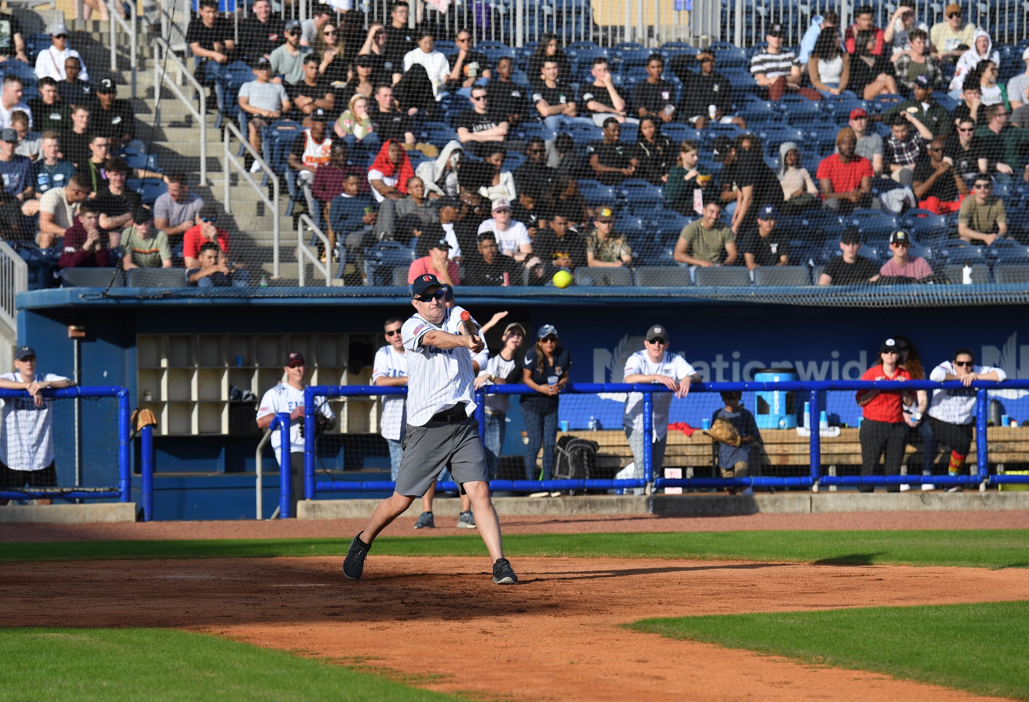 U.S. Navy Capt. Jeff Powell, Naval Construction Battalion Center commanding officer, Gulfport, Mississippi, swings at a softball during the 2nd Annual Chiefs vs. Eagles softball game at MGM Park in Biloxi, Mississippi, Dec. 5, 2022.