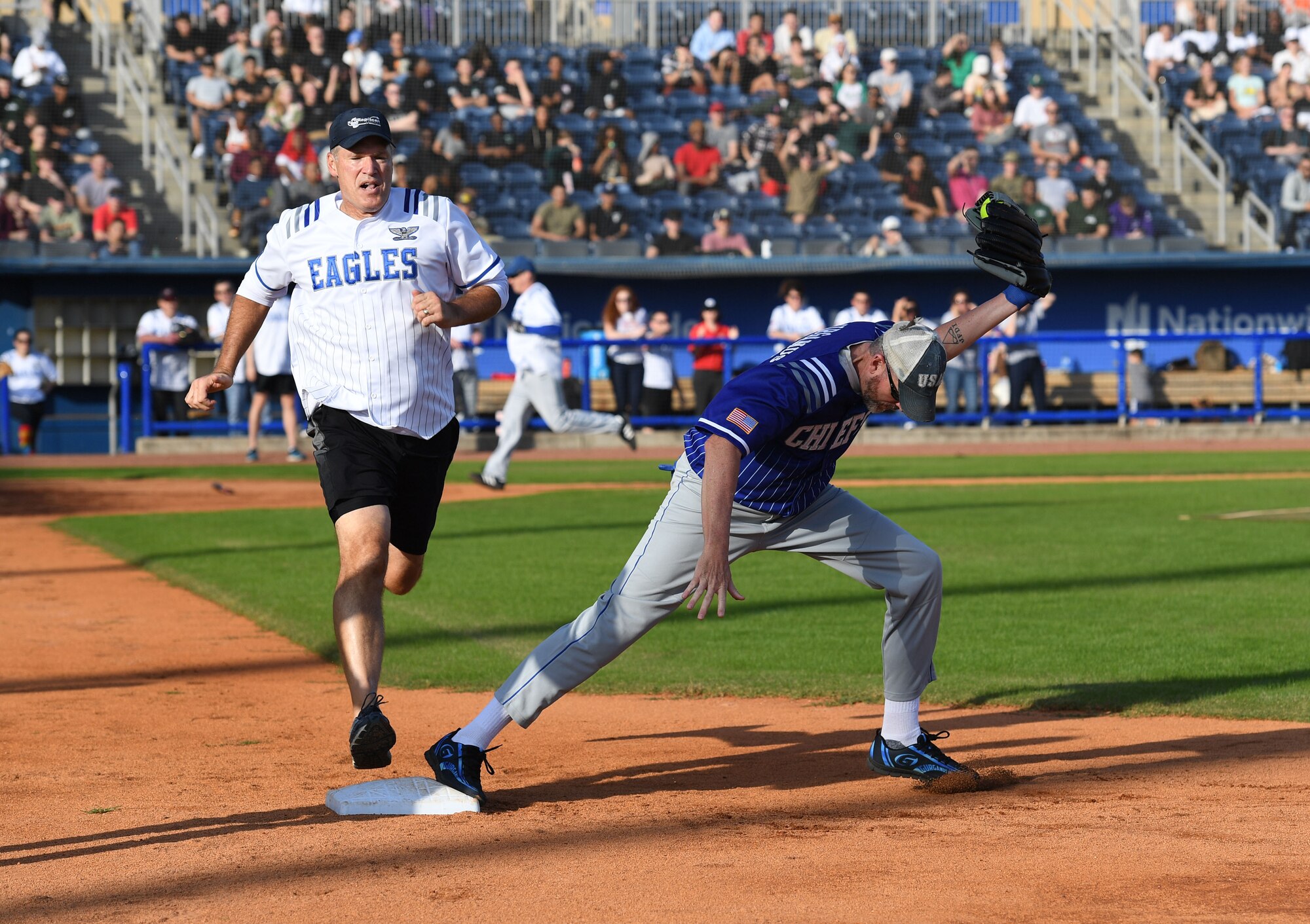 U.S. Air Force Col. David Carr, 81st Training Wing chaplain, and Retired Chief Master Sgt. Don Gurganus participate in the 2nd Annual Chiefs vs. Eagles softball game at MGM Park in Biloxi, Mississippi, Dec. 5, 2022.