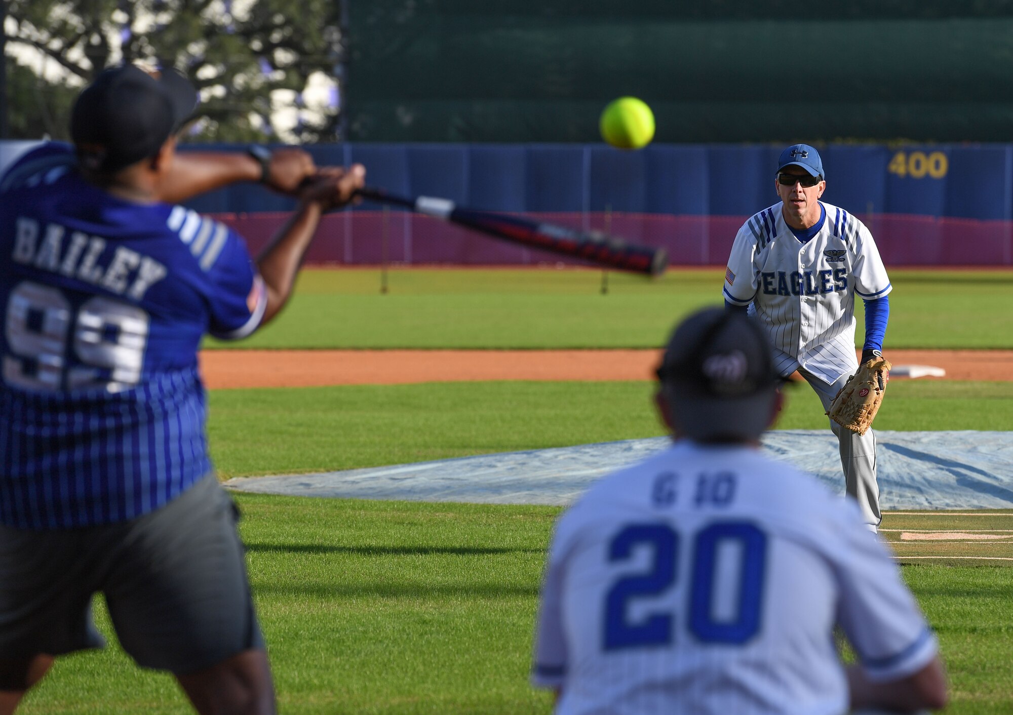 U.S. Air Force Chief Master Sgt. Kodi Bailey, 333rd Training Squadron senior enlisted leader, and Col. William Hunter, 81st Training Wing commander, participate in the 2nd Annual Chiefs vs. Eagles softball game at MGM Park in Biloxi, Mississippi, Dec. 5, 2022.