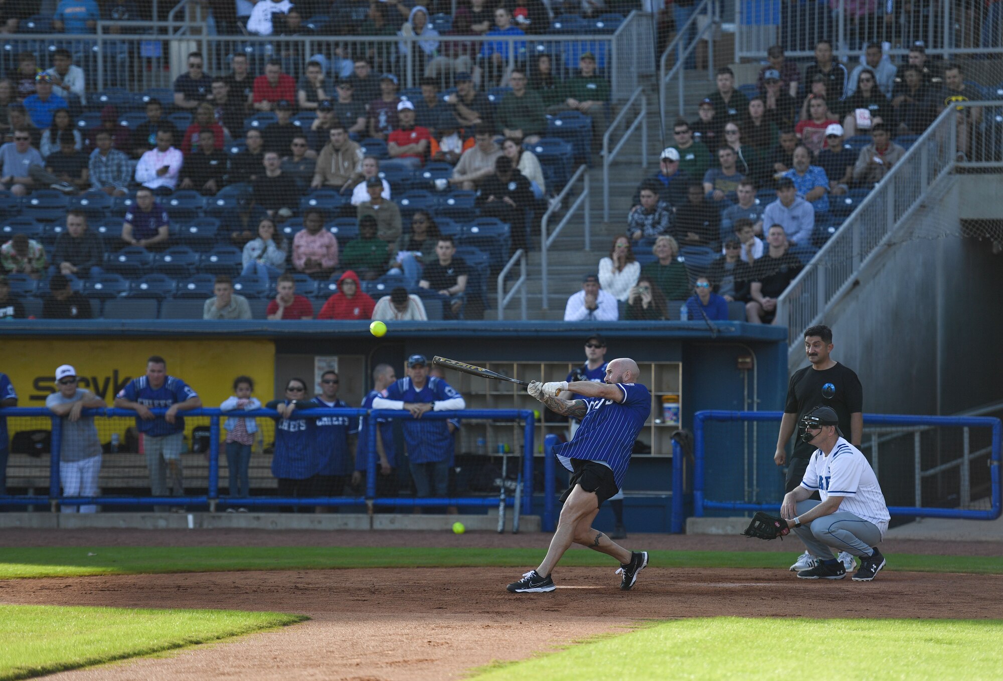U.S. Air Force Retired Chief Master Sgt. Jason Buckley swings at a softball during the 2nd Annual Chiefs vs. Eagles softball game at MGM Park in Biloxi, Mississippi, Dec. 5, 2022.