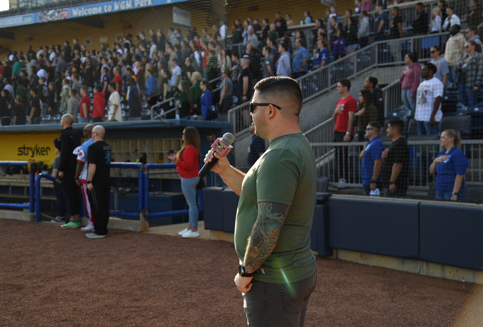 U.S. Air Force Master Sgt. Derek Cameron, 81st Force Support Squadron readiness NCO, sings the national anthem during the 2nd Annual Chiefs vs. Eagles softball game at MGM Park in Biloxi, Mississippi, Dec. 5, 2022.