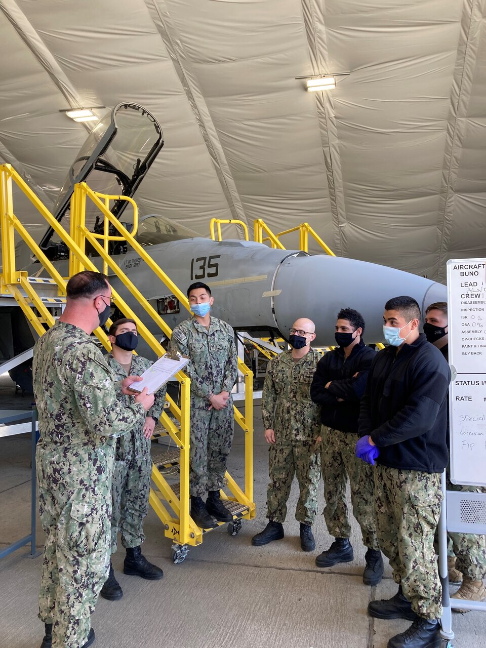 AM1 Adam Keddington conducts Maintenance Reset corrosion treatment and prevention training with Sailors from Strike Fighter Squadron (VFA) 122.