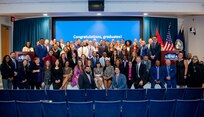 Graduates from Naval Sea System Command’s (NAVSEA) 2022 Leadership Continuum Programs pose with NAVSEA Executive Director Giao Phan (center seated) after their graduation ceremony on Sept. 16, 2022, at the Washington Navy Yard. (U.S. Navy photo by Jensen Stidham)