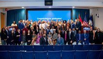 Graduates from Naval Sea System Command’s (NAVSEA) 2022 Leadership Continuum Programs pose with NAVSEA Executive Director Giao Phan (center seated) after their graduation ceremony on Sept. 16, 2022, at the Washington Navy Yard. (U.S. Navy photo by Jensen Stidham)