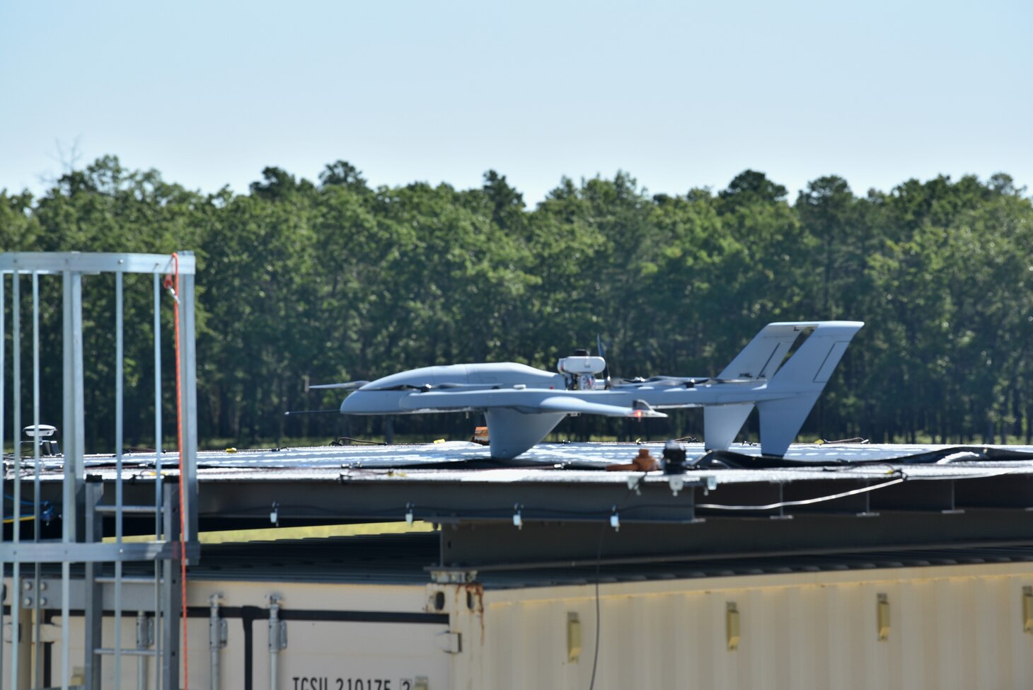 An unmanned aerial vehicle approaches and lands on the Ship Motion Platform at Naval Air Warfare Center Aircraft Division Lakehurst, New Jersey.