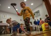 Children, housed at the Dom Dziecka P.W. Sw. Jozefa Zgromadzenia Sióstr Elżbietanek, the Orphanage of St. Joseph of the Congregation of the Elizabethan Sister, play with a miniature golf set during a gift exchange in Bolesławiec, Poland, Dec. 1, 2022. The gifts were donated to children living at the orphanage by Soldiers assigned to the 1st Infantry Division who are working in communities of NATO allies and regional security partners while providing combat-credible forces to V Corps, America’s forward deployed corps in Europe. (U.S. Army photo by Spc. Charles Leitner)