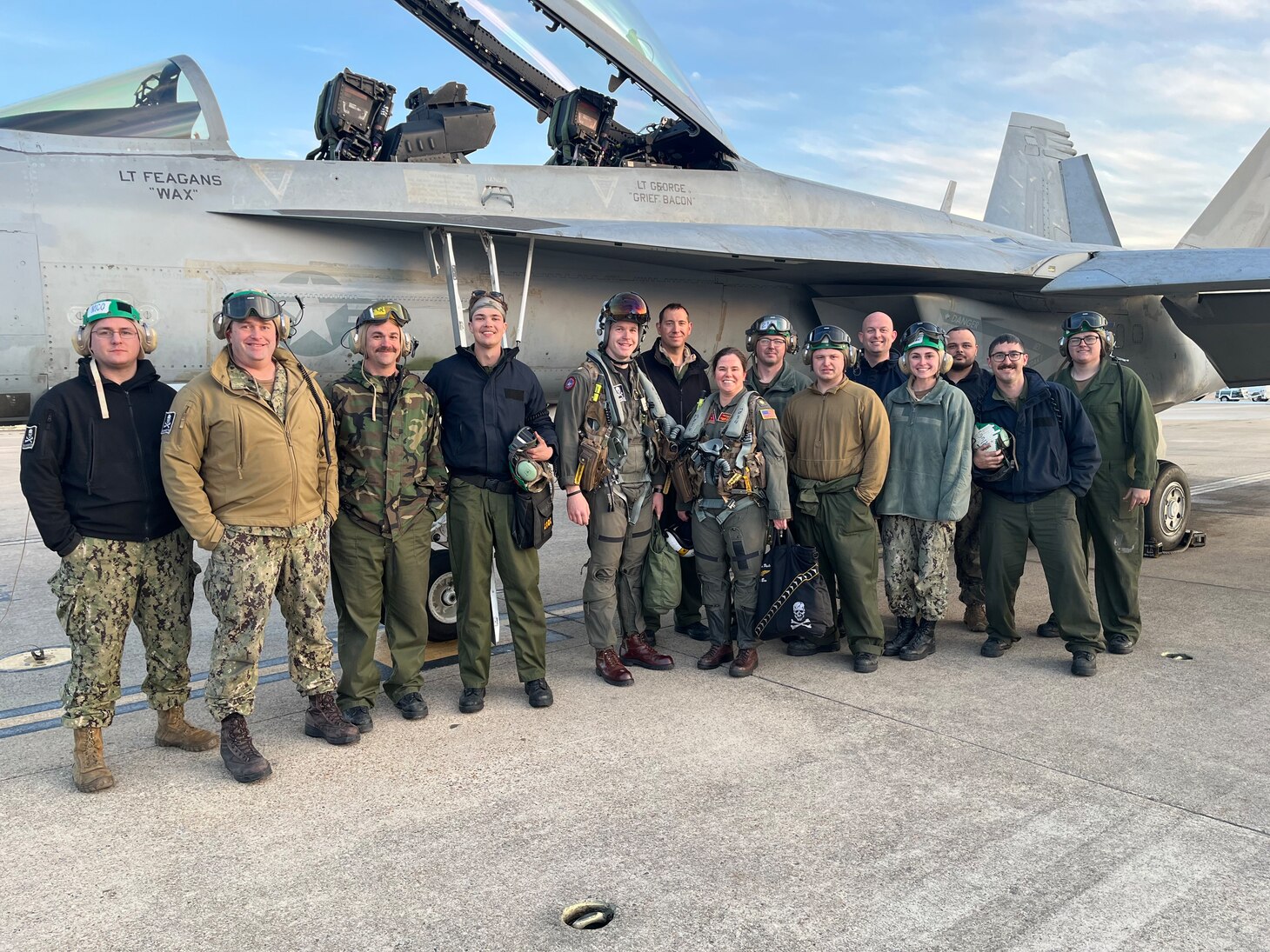 Members of the 205 build team pose with the functional check flight aircrew, celebrating the aircraft’s first flight.