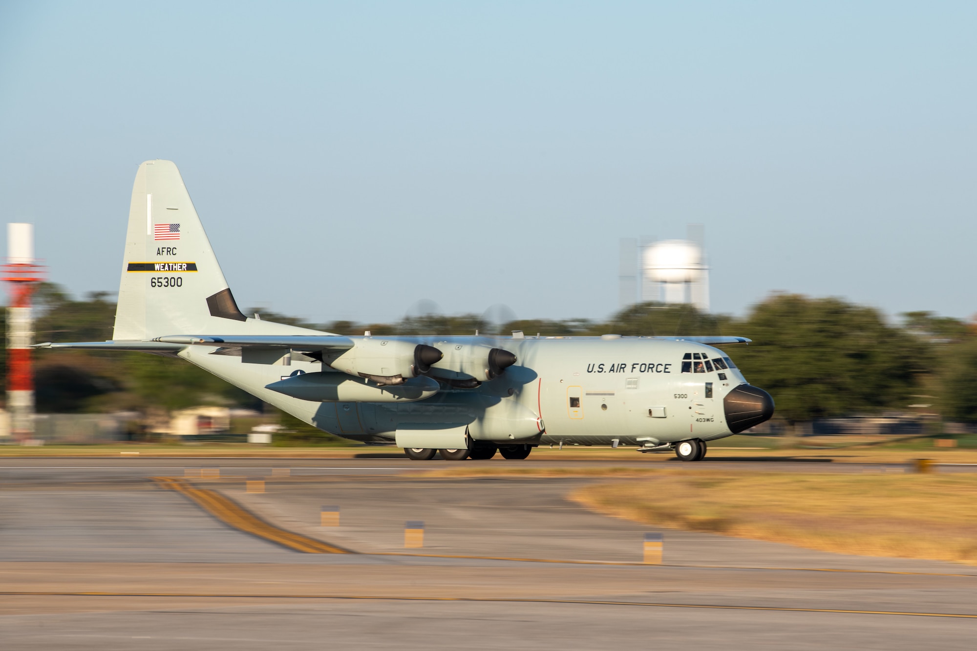 A WC-130J begins to take off
