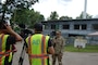 Camera crew in front of building while interviewing the Baltimore District commander.