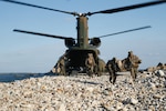 U.S. Marines with 1st Battalion, 2d Marines and members of the Japan Self-Defense Force Amphibious Rapid Deployment Brigade offload a Japan Self Defense Force CH-47JA Chinook helicopter during Keen Sword 23 at Tsutara, Japan, Nov. 16, 2022. Keen Sword is a biennial training event that exercises the combined capabilities and lethality developed between 3d Marine Division, III Marine Expeditionary Force, and the Japan Self-Defense Force. This bilateral field-training exercise between the U.S. military and JSDF strengthens interoperability and combat readiness of the U.S.-Japan Alliance.