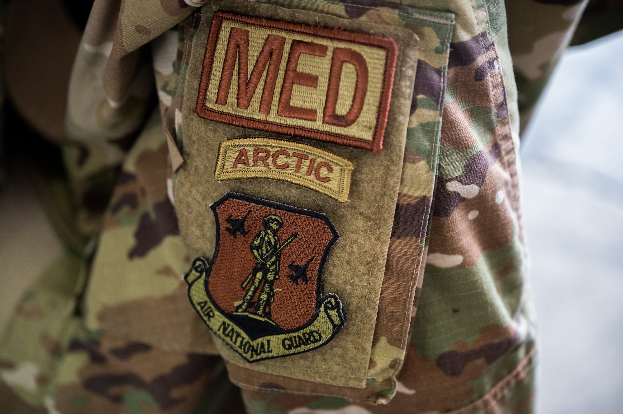 Photo of Airmen from the Alaska Air National Guard and contractors setting up a Tactical Shelter.