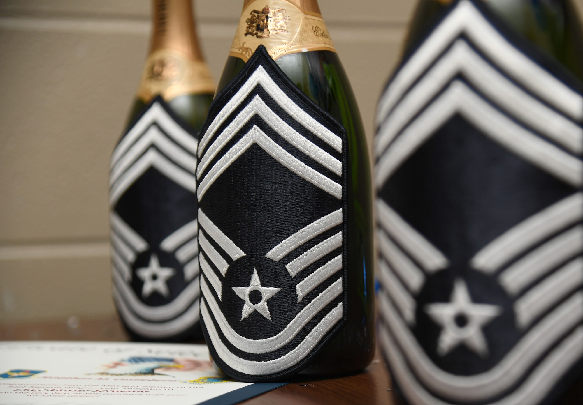 Bottles of champagne are displayed during the chief master sergeant release ceremony inside Gaude Lanes at Keesler Air Force Base, Mississippi, Dec. 6, 2022.