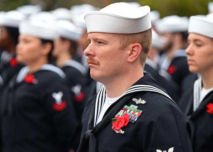 U.S. Navy Sailors stand in formation during the Pearl Harbor Remembrance Day ceremony at Fairmount Cemetery, San Angelo, Texas, Dec. 7, 2022. Guest speakers provided history on the events of Pearl Harbor and the San Angelo natives who experienced them. (U.S. Air Force photo by Senior Airman Ethan Sherwood)