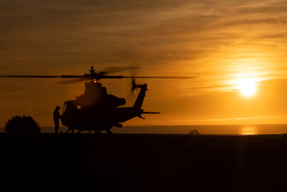 A U.S. Marine Corps UH-1Y Venom pilot with Marine Light Attack Helicopter Squadron 169, Marine Aircraft Group 39, 3rd Marine Aircraft Wing (MAW), prepares to take off from a forward arming and refueling point during exercise Steel Knight 23 on Red Beach, Camp Pendleton, California, Dec. 3, 2022. Exercise Steel Knight 23 provides 3rd MAW an opportunity to refine Wing-level warfighting in support of I Marine Expeditionary Force and fleet maneuver. (U.S. Marine Corps photo by Sgt. Rachaelanne Woodward)