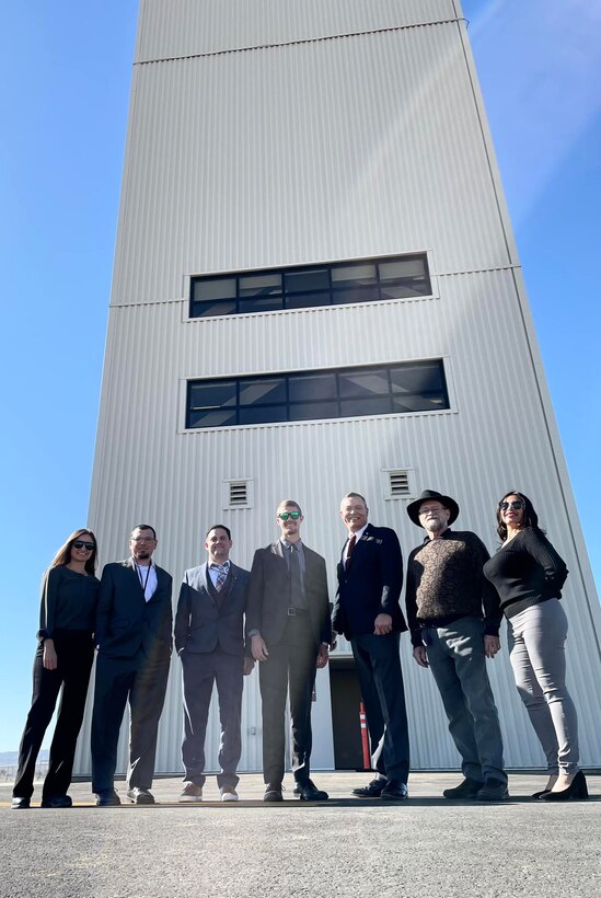 Justin Gay, deputy district engineer, U.S. Army Corps of Engineers Los Angeles District, third from right, along with other LA District representatives from the Corps' Palmdale Resident and Edwards Air Force Base offices, pose for a picture in front of the new air traffic control tower following a ribbon-cutting ceremony celebrating the completion of the tower Nov. 30 at Air Force Plant 42, Palmdale, California.