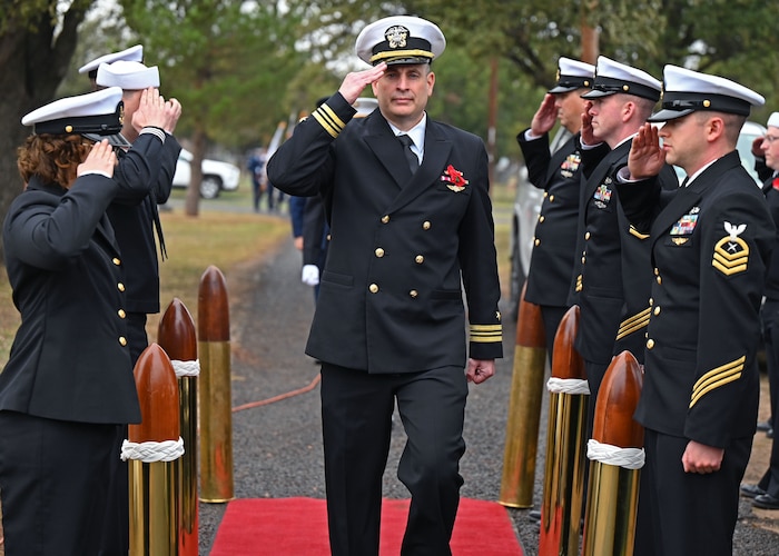 U.S. Navy Lt. Cmdr. Mark Wess, Center for Information Warfare Training Detachment Goodfellow officer in charge, salutes as he arrives to the Pearl Harbor Remembrance Day ceremony at Fairmount Cemetery, San Angelo, Texas, Dec. 7, 2022. Wess attended to honor those who paid the ultimate price at Pearl Harbor. (U.S. Air Force photo by Senior Airman Ethan Sherwood)