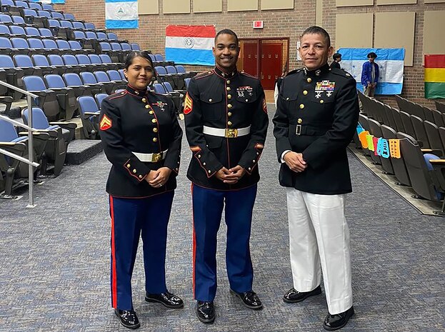 U.S. Marine Corps Lt.Col. Jose Montalvan, right, a logistics officer, U.S. Marine Cpl. Carmen Jaimes, left, a legal services specialist, and U.S. Marine Sgt. Shareef Jones, center, a recruiter with Marine Corp recruiting station Frederick, attend the first Hispanic heritage month celebration at Gar-Field high school in Woodbridge, Virginia Oct. 4, 2022. The ceremony was held by the school as an opportunity for students to share in their heritage by preforming traditional dances, sharing food, and giving oral presentations about Hispanic heritage. (Courtesy photo by U.S. Marine Corps Lt.Col. Jose Montalvan)
