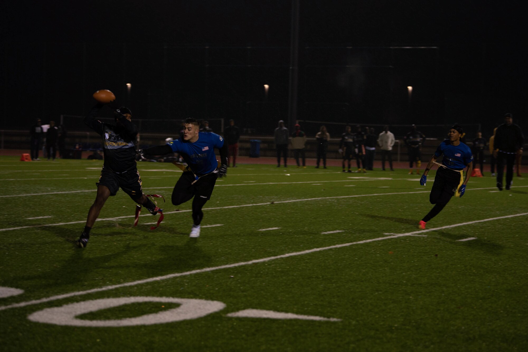 Airmen and Soldiers play flag football