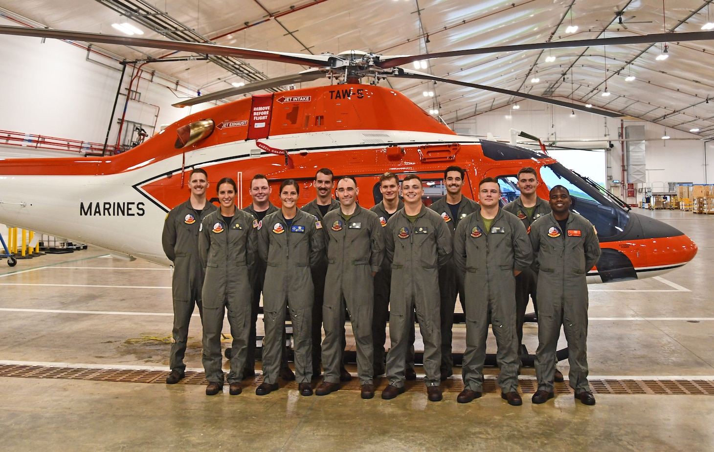 TH-73A Students: Training Air Wing Five’s first 12 student naval aviators to begin training in the new TH-73A Thrasher helicopter stand in front of one of the aircraft in early September