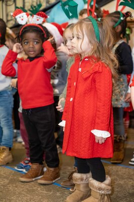 Small boy and girl in singing.