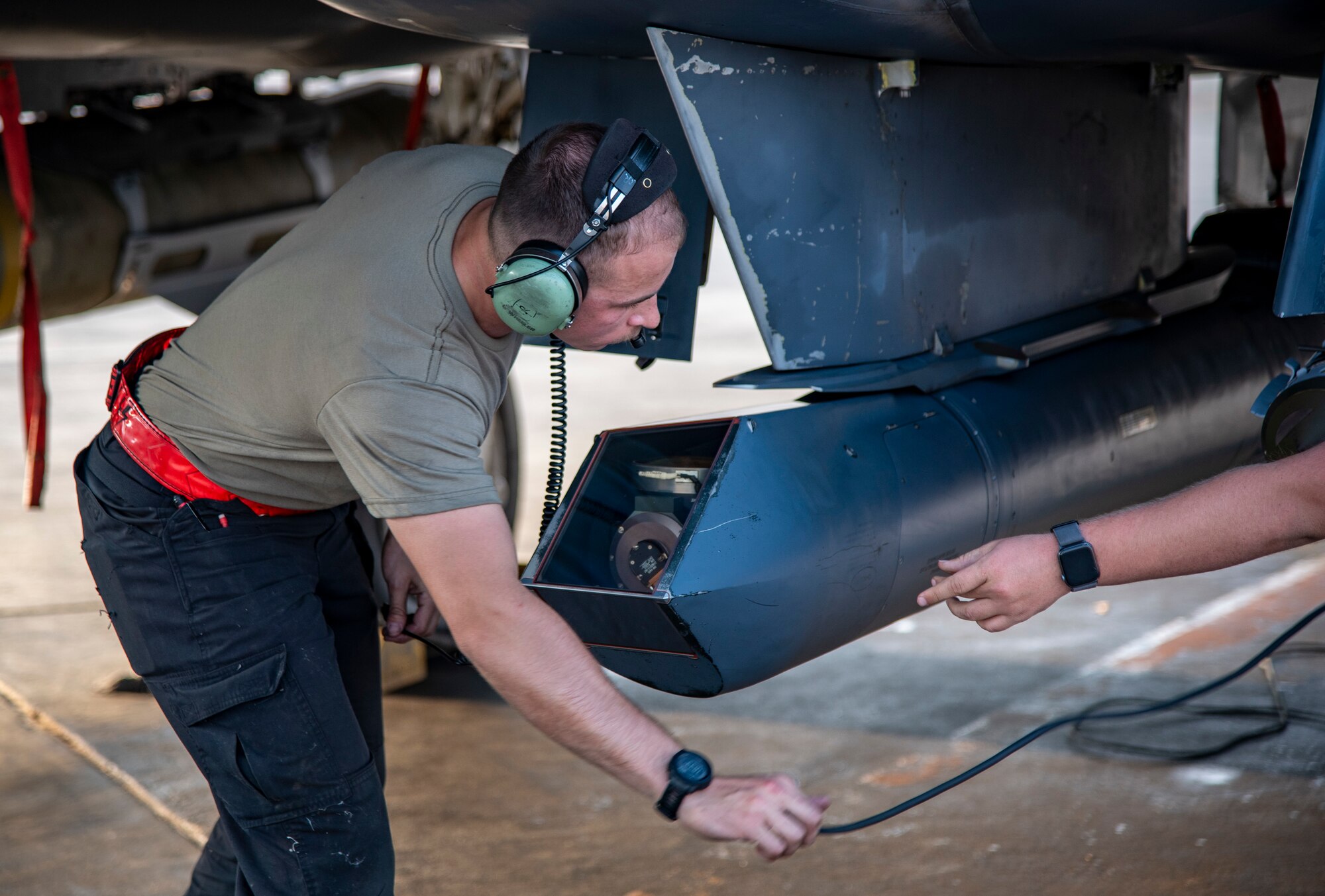 Airman 1st Class William Airman 1st Class Leyton Wheeler, 332d Expeditionary Fighter Generation Squadron crew chief, performs a preflight inspection on an F-15E Strike Eagle at an undisclosed location, Southwest Asia, Nov. 15, 2022. Preflight checks allow aircrew to guarantee that all systems are working properly, reducing the risk of in-flight emergencies. (U.S. Air Force photo by: Tech. Sgt. Jim Bentley)