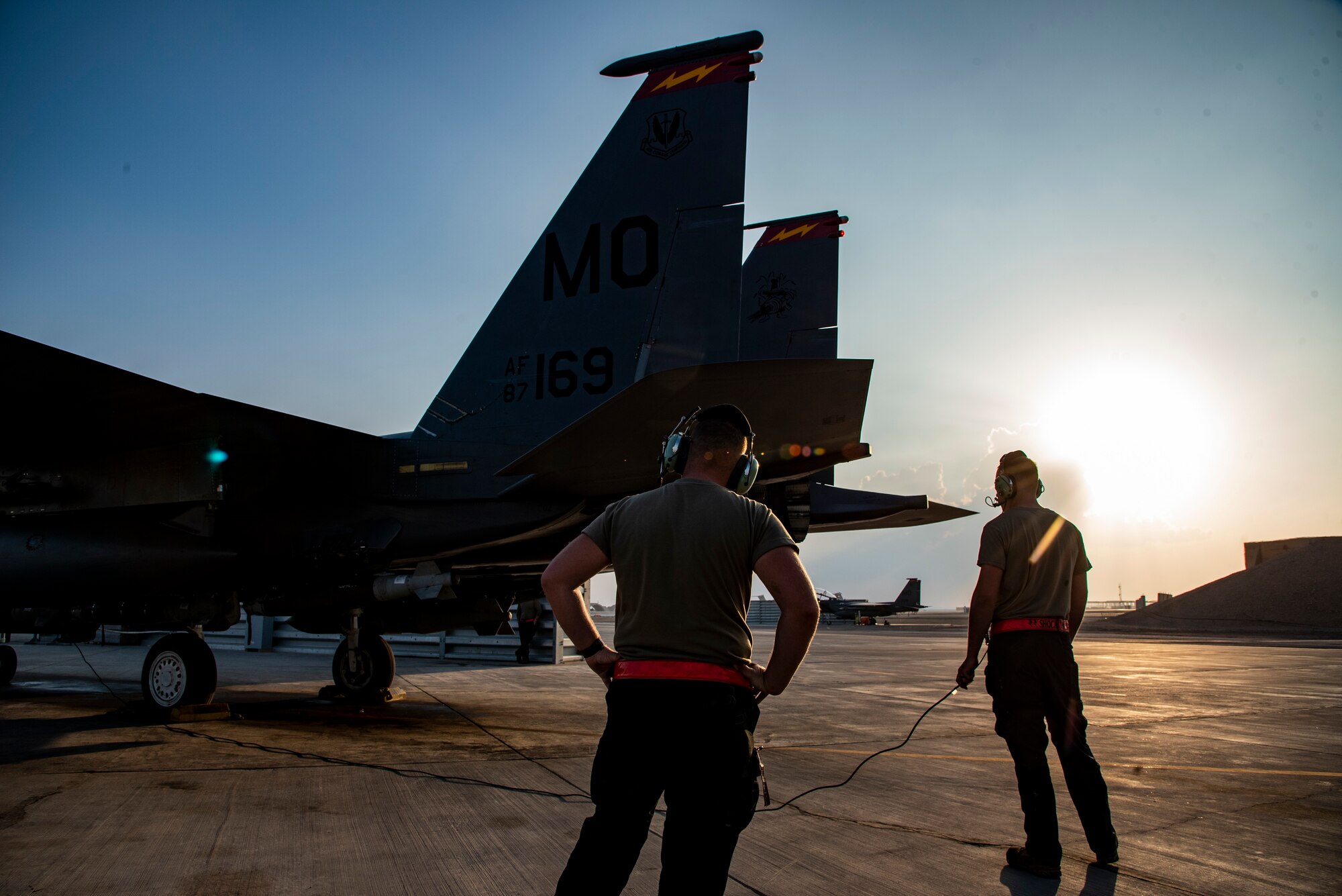 Airman 1st Class William Phillips, 389th Expeditionary Fighter Squadron crew chief, and Airman 1st Class Leyton Wheeler, 332d Expeditionary Fighter Generation Squadron crew chief, perform preflight operations on an F-15E Strike Eagle at an undisclosed location, Southwest Asia, Nov. 15, 2022. Preflight checks allow aircrew to guarantee that all systems are working properly, reducing the risk of in-flight emergencies. (U.S. Air Force photo by: Tech. Sgt. Jim Bentley)