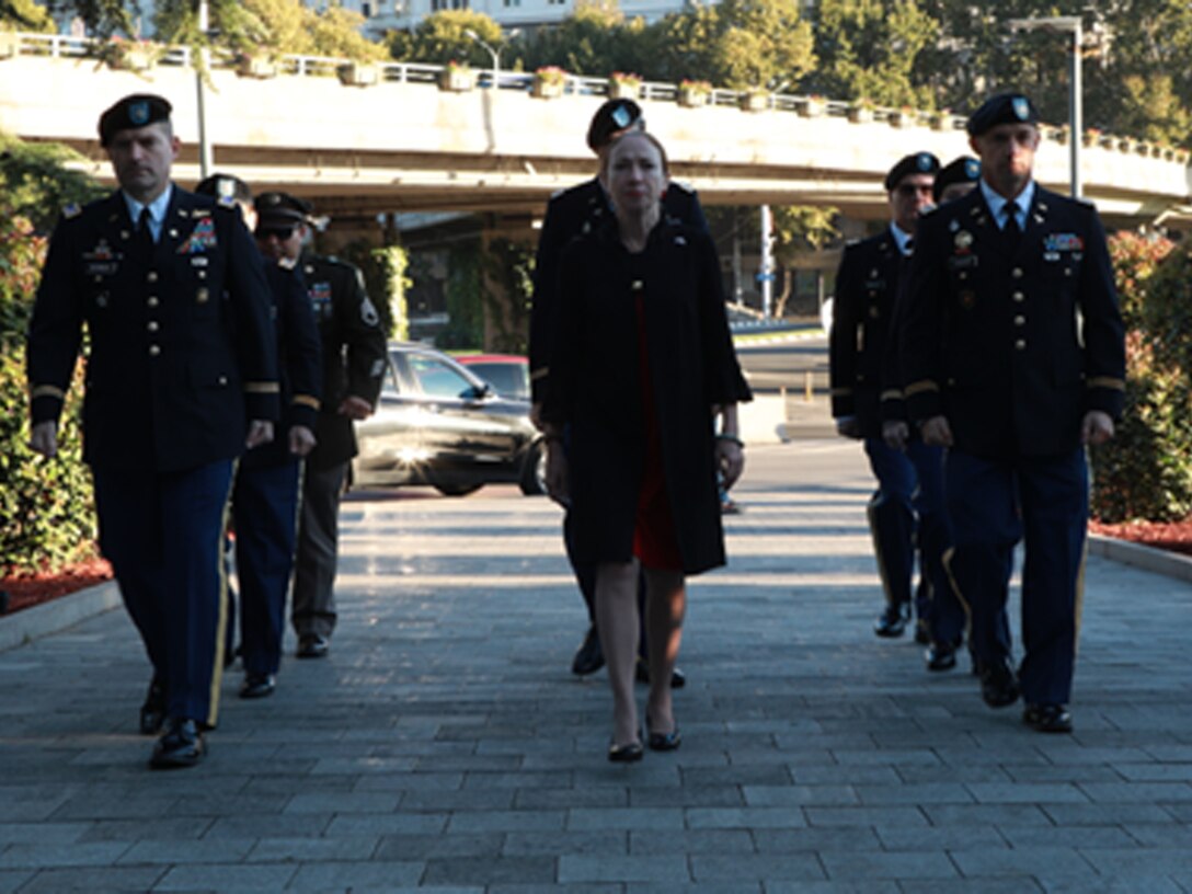Members from U.S. Army Medical Research Directorate-Georgia render a salute during a wreath laying ceremony Sept. 27.