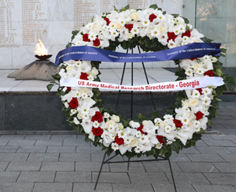 Members from U.S. Army Medical Research Directorate-Georgia render a salute during a wreath laying ceremony Sept. 27.