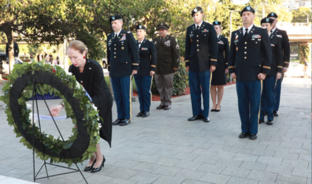 Members from U.S. Army Medical Research Directorate-Georgia render a salute during a wreath laying ceremony Sept. 27.