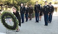 Members from U.S. Army Medical Research Directorate-Georgia render a salute during a wreath laying ceremony Sept. 27.