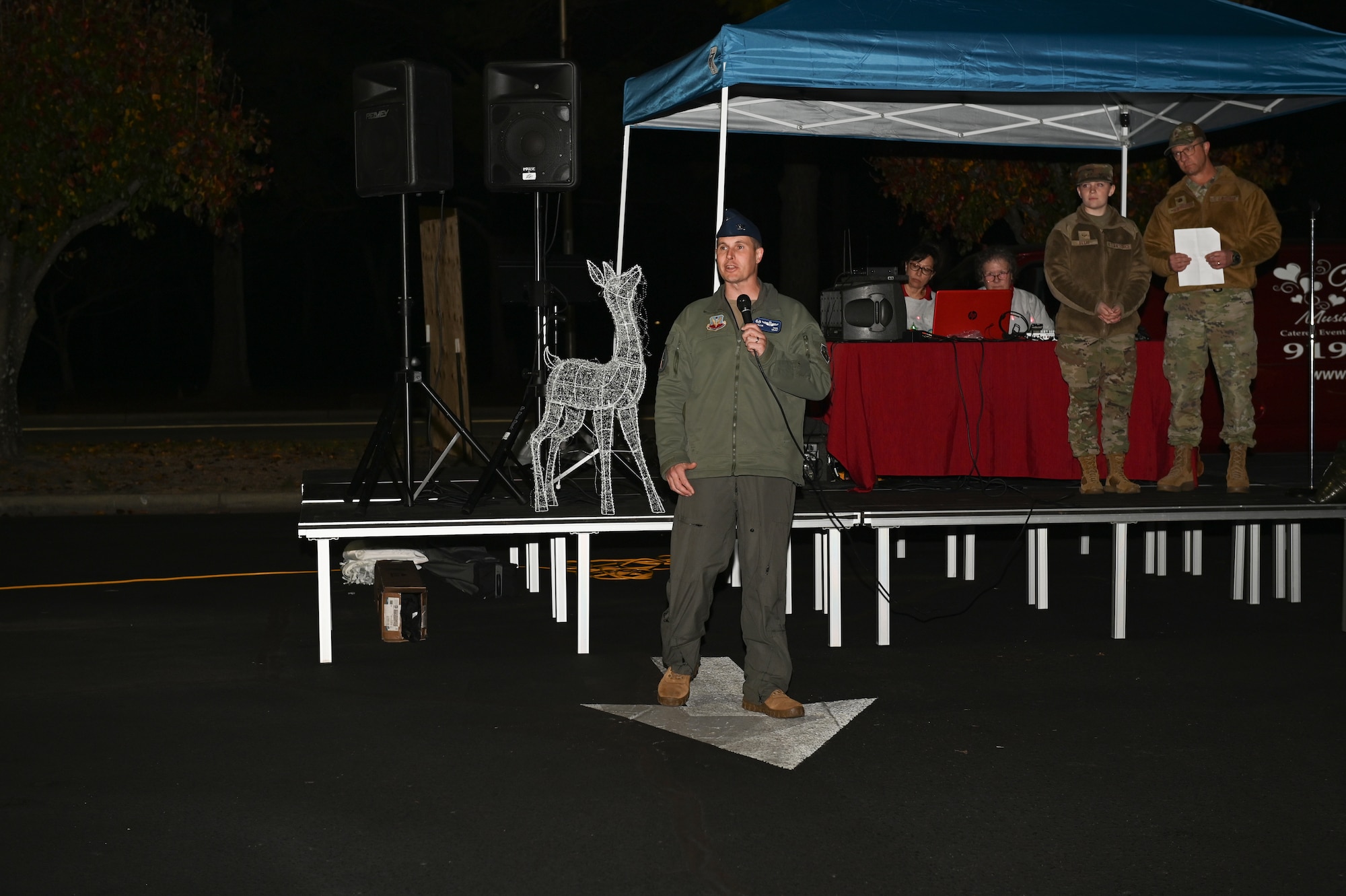 Col. Lucas Teel, 4th Fighter Wing commander, speaks to Airmen and their families during the Holiday Village and vendor fair at Seymour Johnson Air Force Base, North Carolina, Dec. 5, 2022. The annual event is held to celebrate the beginning of the holiday season. (U.S. Air Force photo by Airman 1st Class Rebecca Sirimarco-Lang)