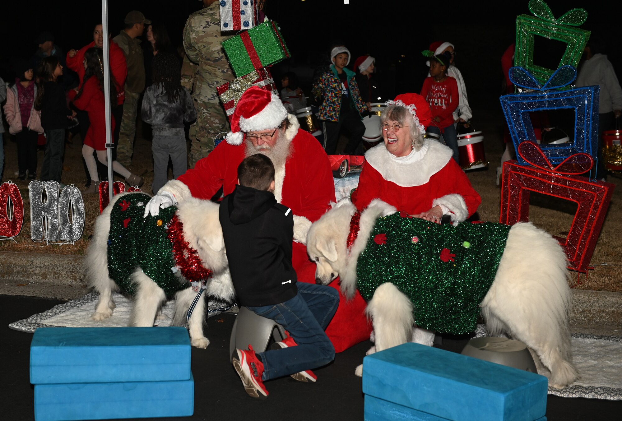 Children speak with Santa and Mrs. Claus during the Holiday Village and vendor fair at Seymour Johnson Air Force Base, North Carolina, Dec. 5, 2022. The celebration is hosted at the beginning of December each year for U.S. service members and their families. (U.S. Air Force photo by Airman 1st Class Rebecca Sirimarco-Lang)