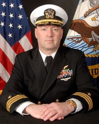 (Dec. 8, 2022) JACKSONVILLE, Fla. -- Official portrait of Cmdr. David J. Badman Jr. (U.S. Navy photo)