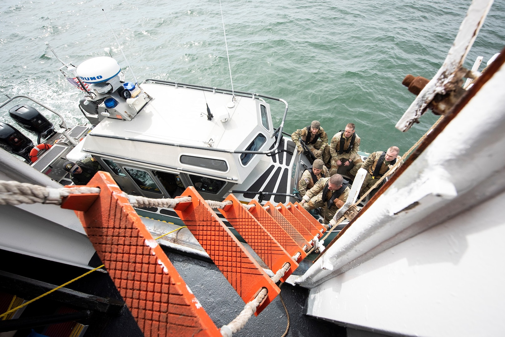 Members from New York’s Department of Environmental Conservation, tactical division attempt to embark the ferry Grand Republic during Sector Long Island Sound’s first embarkation drill in April 2022.