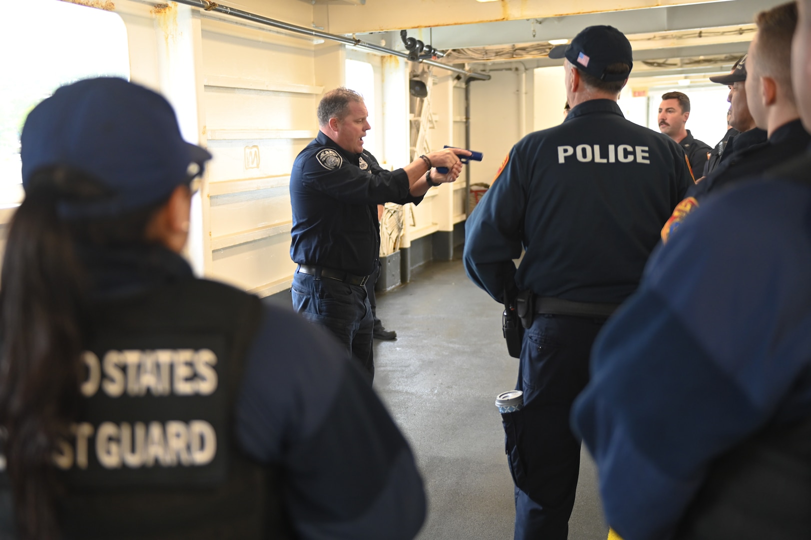 Members from Station Eaton’s Neck, New York, review tactical procedures with Suffolk County, New York Police Department prior to clearing the ferry PT Barnum, during Sector Long Island Sound’s AMSTEP exercise in October 2022.