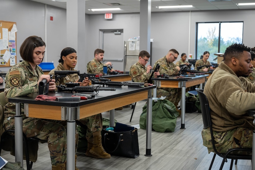 U.S. Air Force Airmen disassemble their M-4 carbine rifles during their Combat Arms Training and Maintenance qualification course at Joint Base Langley-Eustis, Virginia, Nov. 30, 2022.