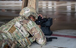 U.S. Air Force 633d Security Forces Squadron Defender shoots his M-4 carbine rifle for his annual weapons qualification testing during a Combat Arms Training and Maintenance qualification course at Joint Base Langley-Eustis, Virginia, Nov. 30, 2022.