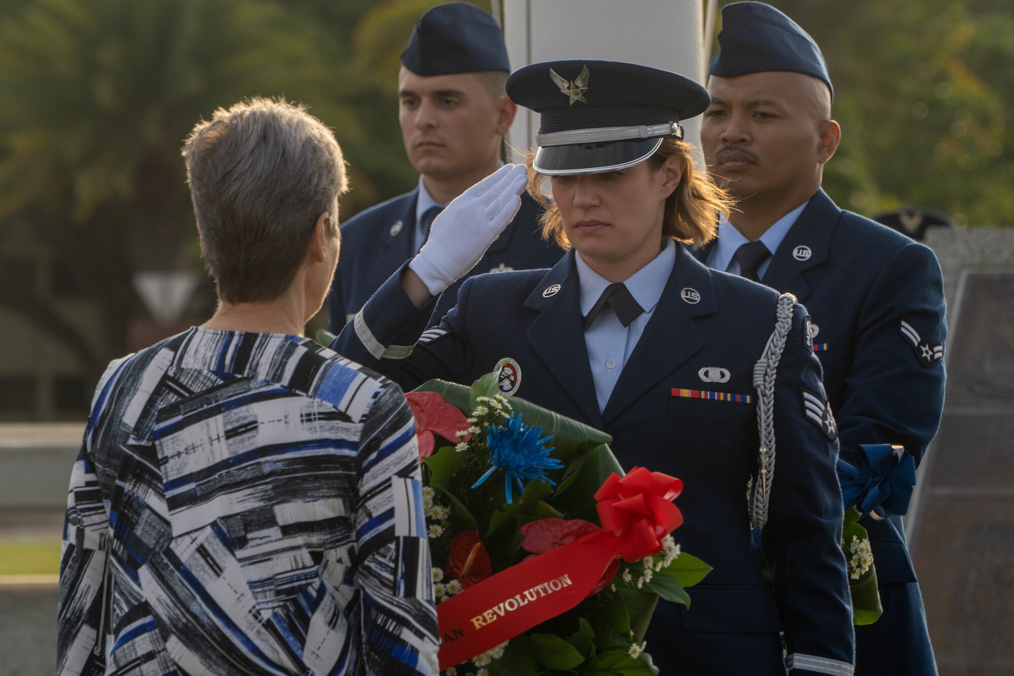 Friends and family of late Hickam Field veteran survivors present a wreath at the Attack on Hickam Field Remembrance Ceremony at Joint Base Pearl Harbor-Hickam, Hawaii, Dec. 7, 2022. The 15th Wing continues to honor those who survived the historic attacks,  those who paid the ultimate sacrifice and their families while reminding those who currently serve of the legacy of those who came before. (U.S. Air Force photo by Senior Airman Makensie Cooper)